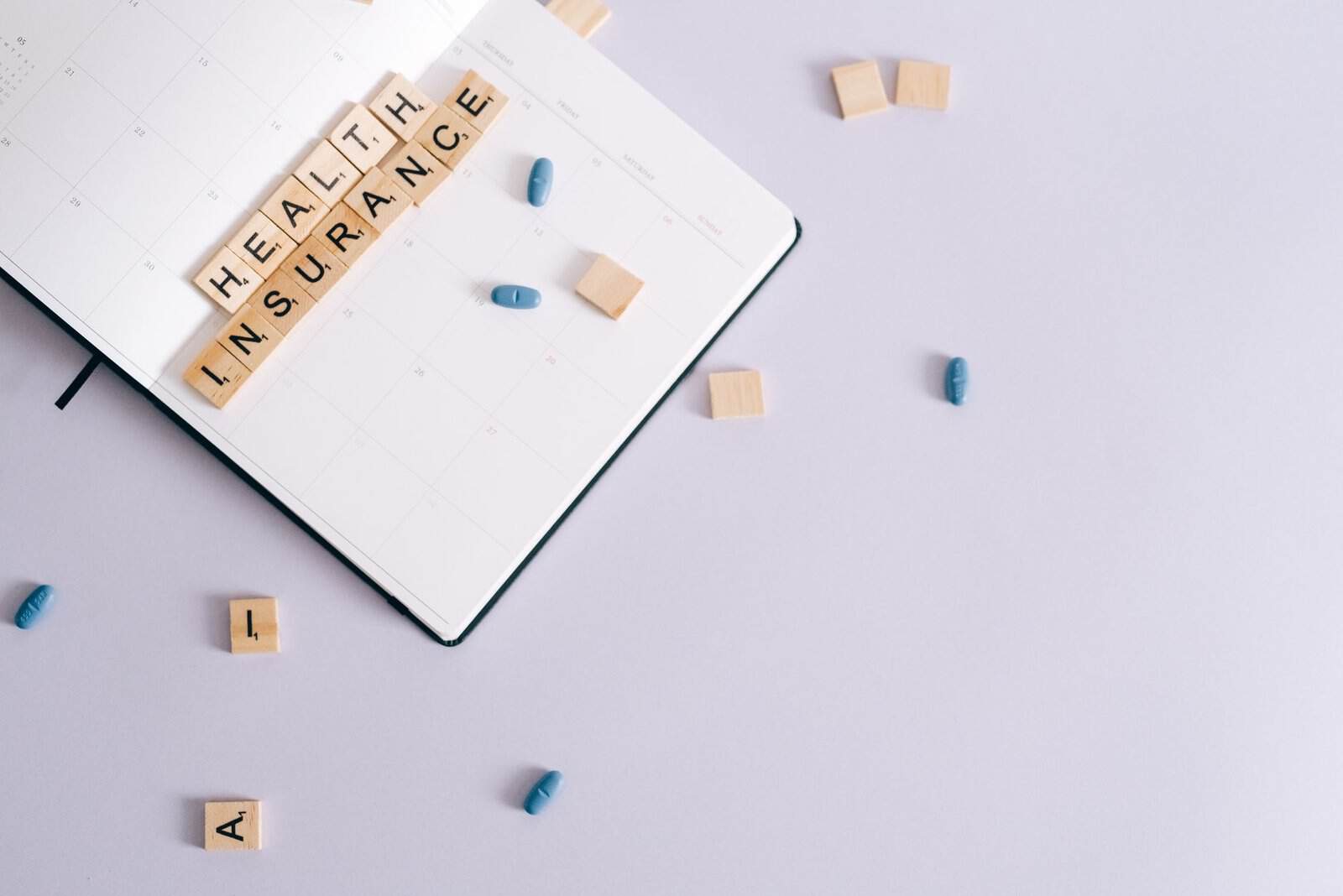 Calculator, papers and glasses on a desk for life insurance planning
