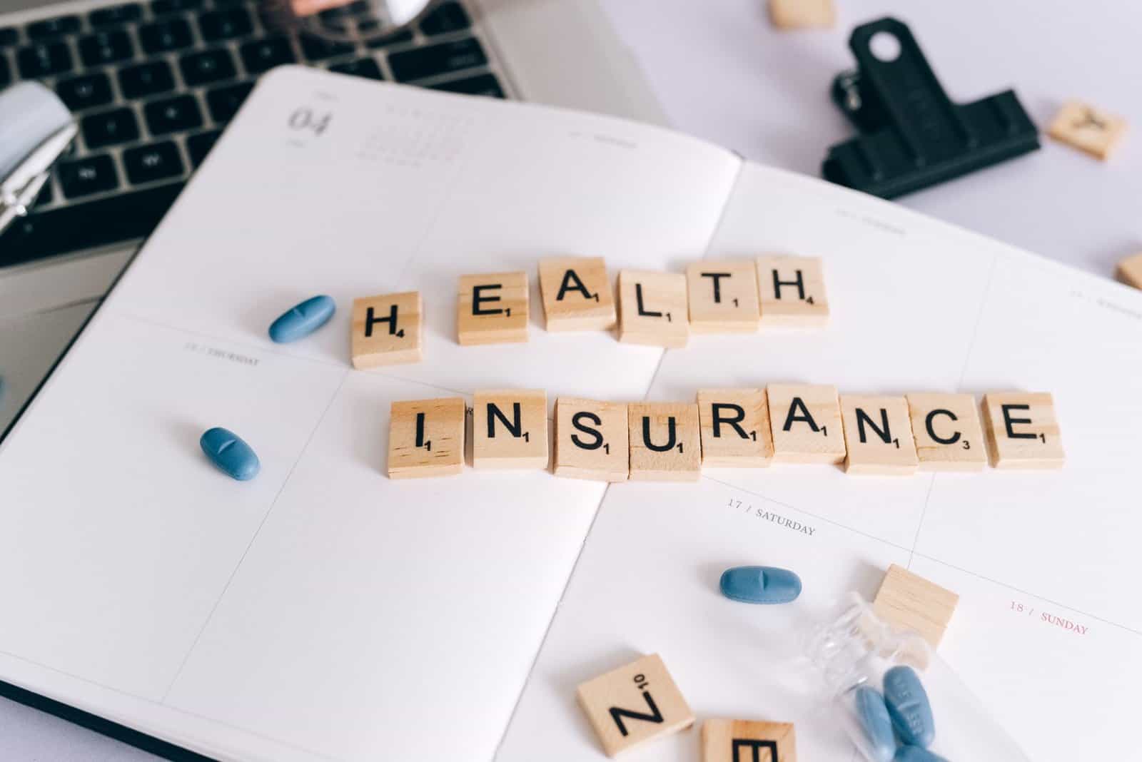 Life insurance paperwork and medical results on a desk in soft daylight