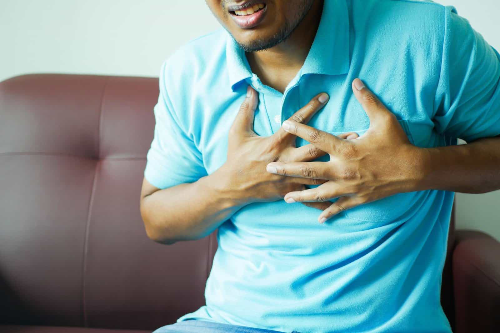 Man reviewing life insurance policy after a heart attack