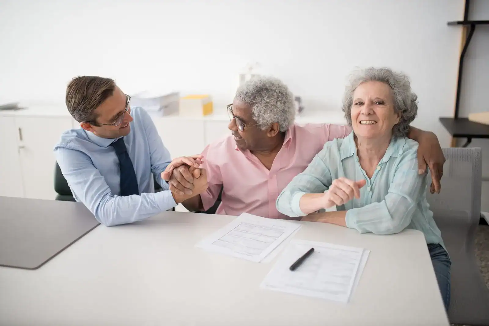 Person updating beneficiary information on a life insurance policy document